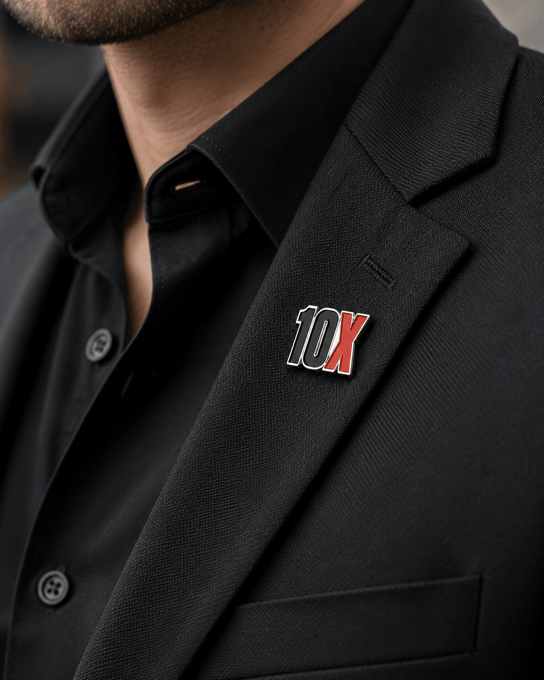 Custom 10X enamel lapel pin on a suit jacket